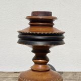 Foot of turned wooden lamp and carved