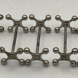 Set of 7 vintage knife rests in the shape of crosses in silver-plated metal.