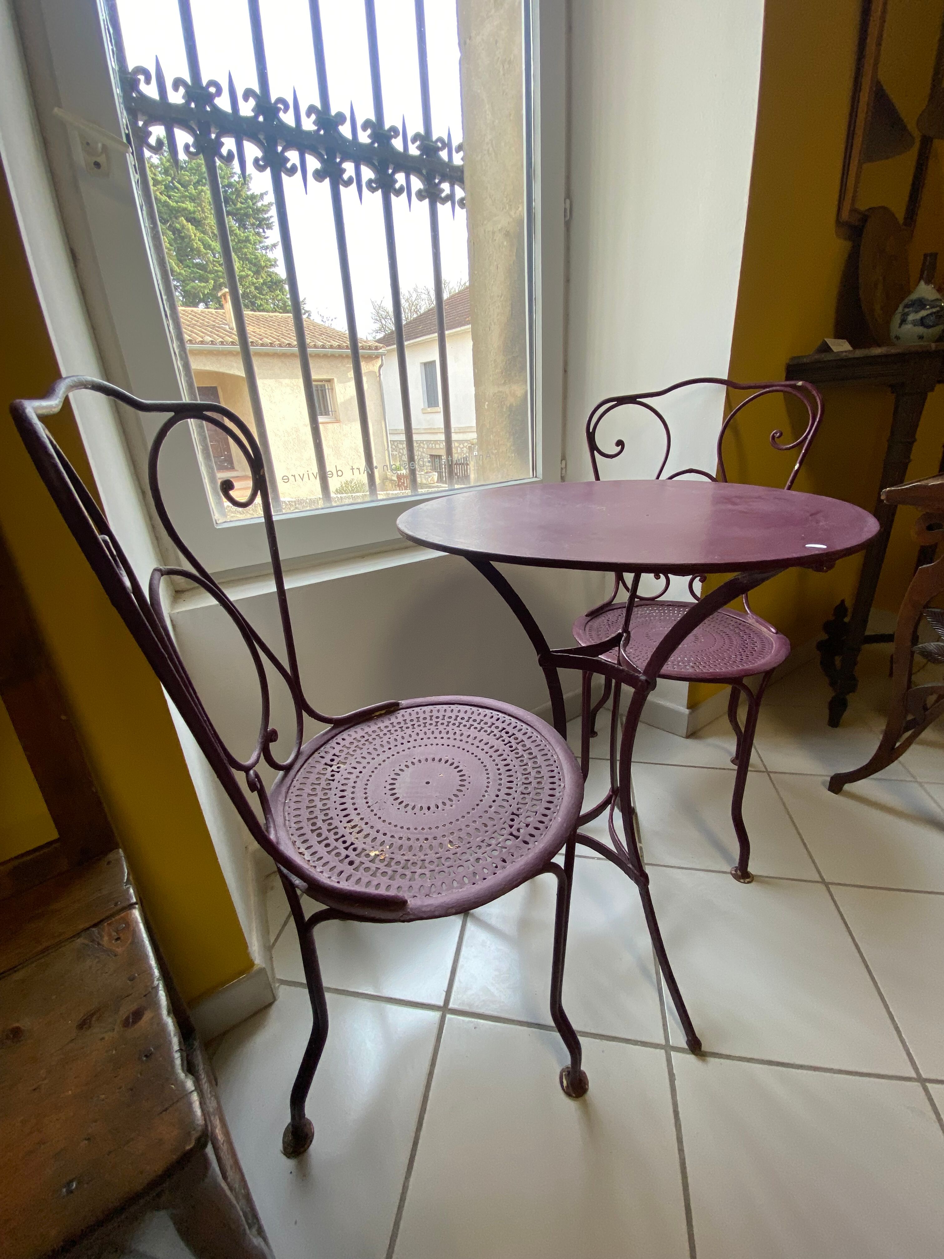 Set of two chairs and wrought iron pedestal table