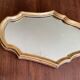 Miroir doré de style Louis XV sobre 32 X 22