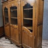 Large Provençal library in Louis XV style made of oak from the 20th century.