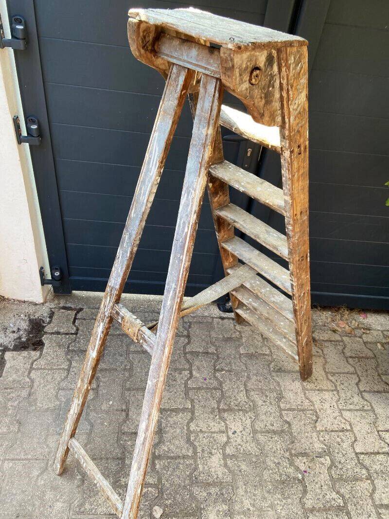 Antique authentic painter's stepladder in vintage patinated wood