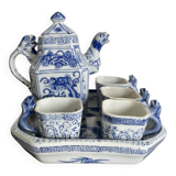 Antique Chinese tea set decorated with dragons.