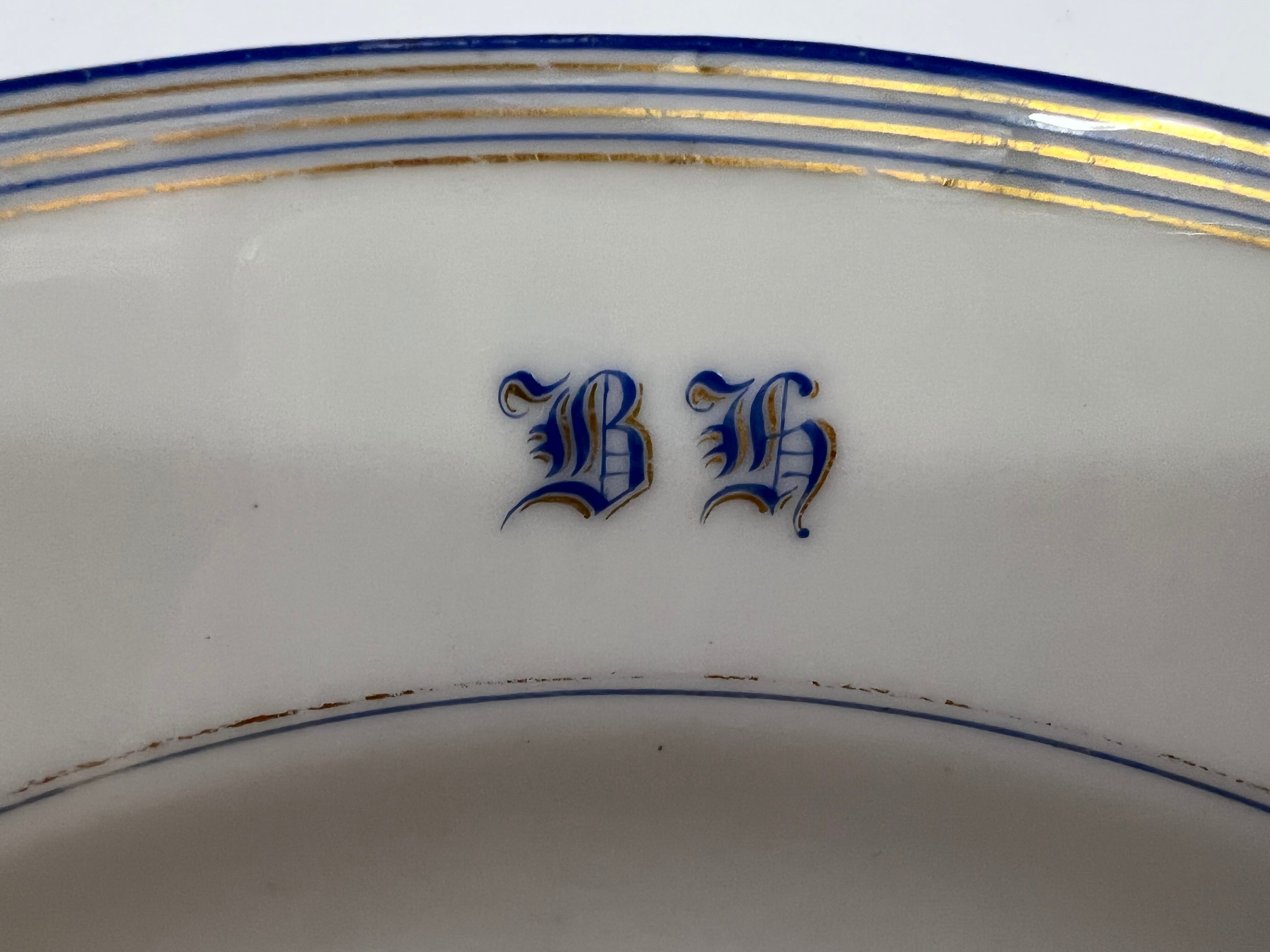 Round dish white monogrammed with blue border 34cm