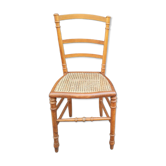 Antique wooden chair with cane seating
