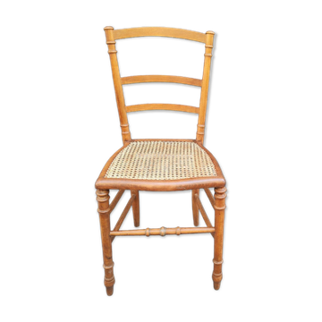 Antique wooden chair with cane seating