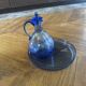 Set of a carafe with its blue glass tray.