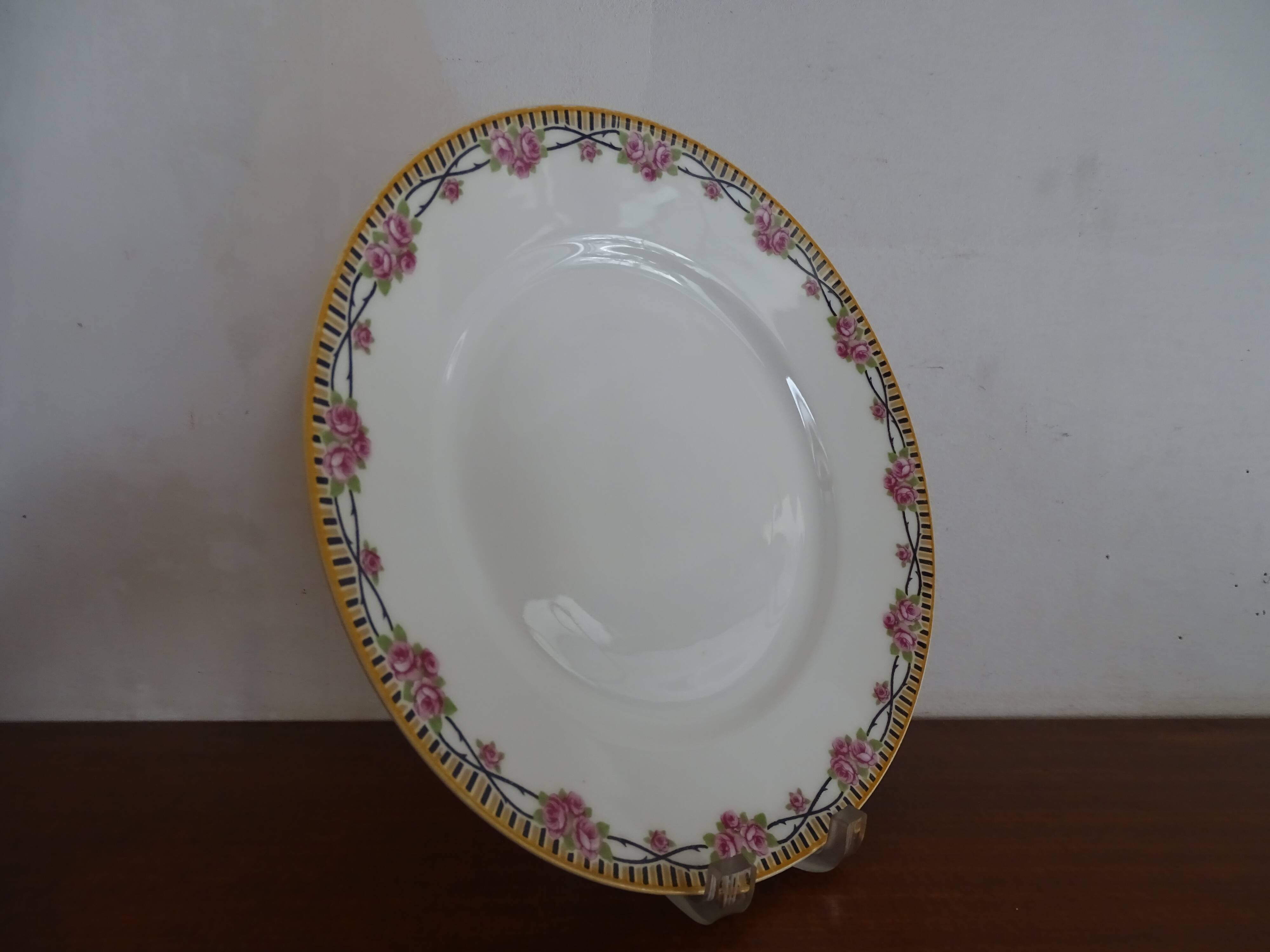 4 assiettes plates porcelaine Limoges Theodore Haviland motifs Art Deco Ø 24, cm