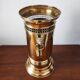 Vintage brass umbrella stand with lion decoration.