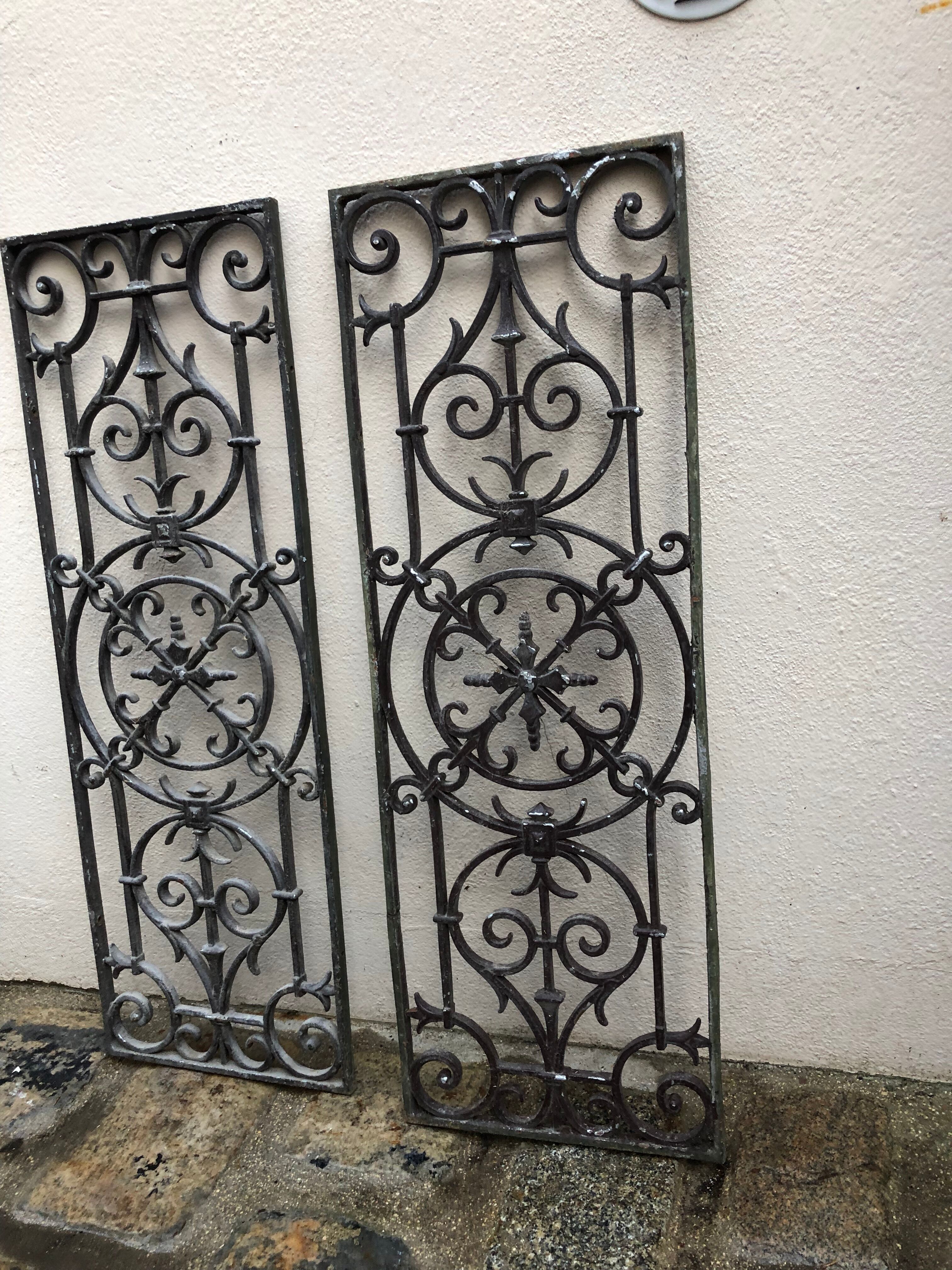 Pair of old cast iron door grilles