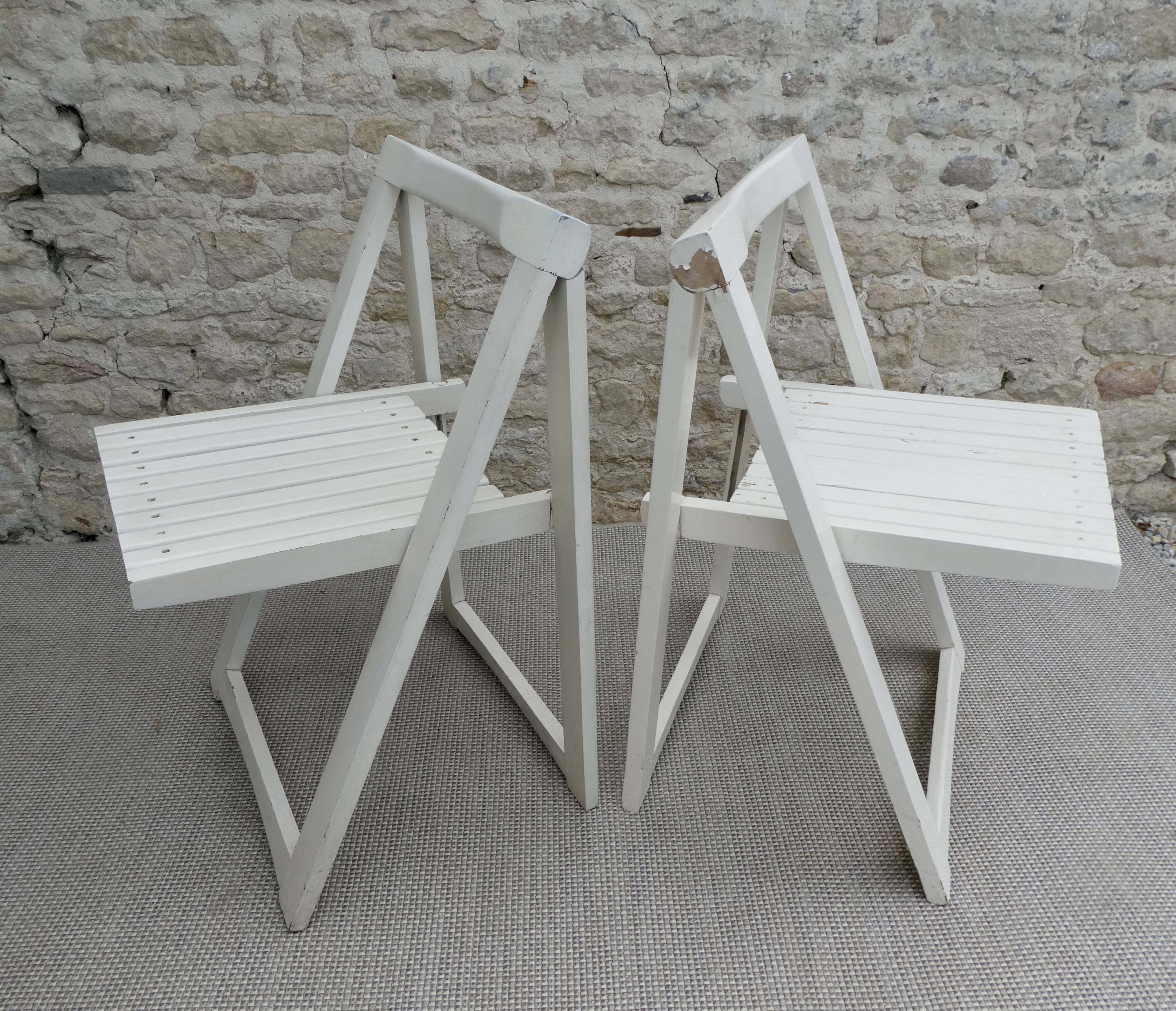 Pair of folding wooden chairs, white patina, circa 1960.