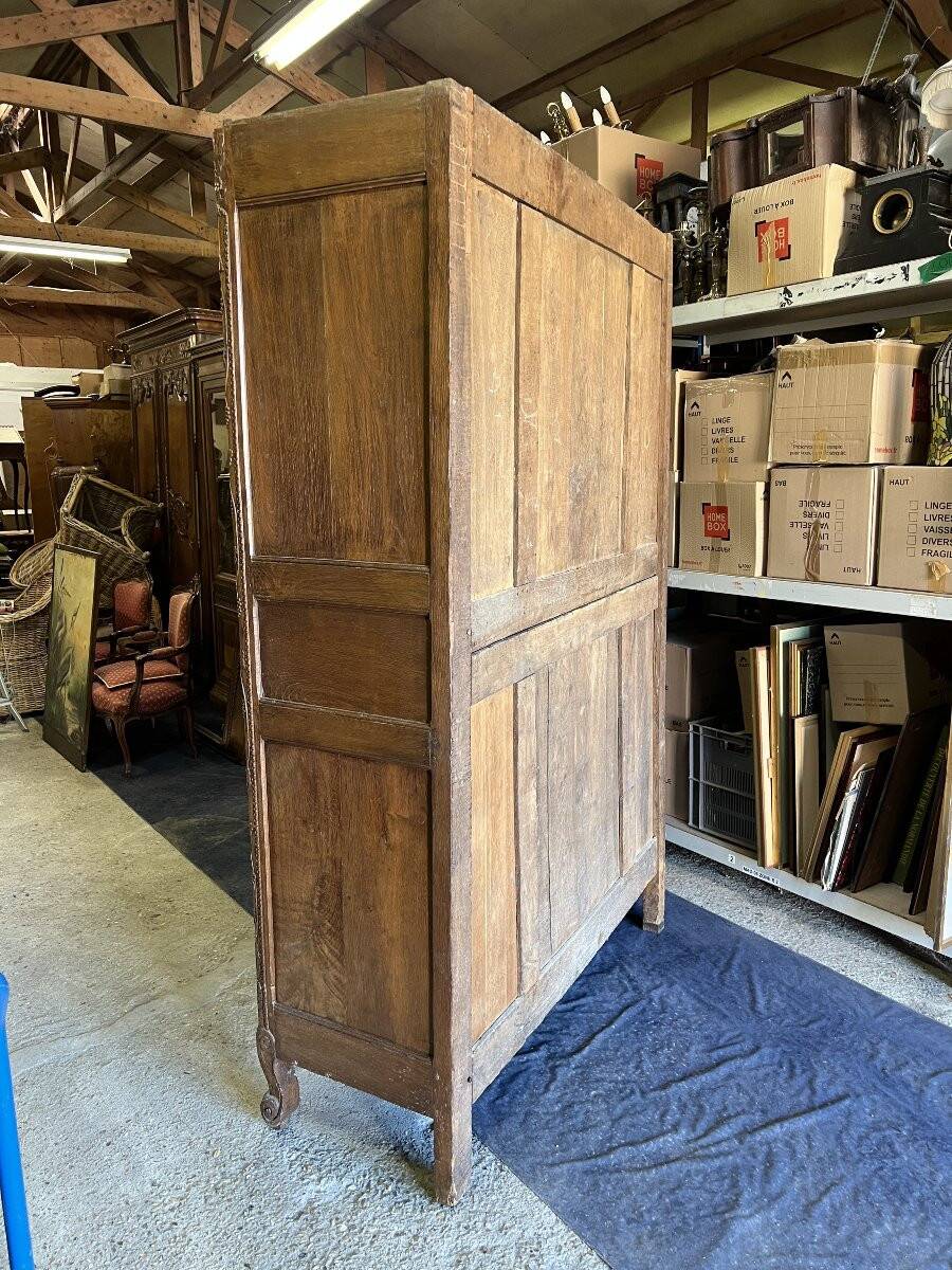 19th-century Norman wedding armoire, with bouquets of flowers and doves.