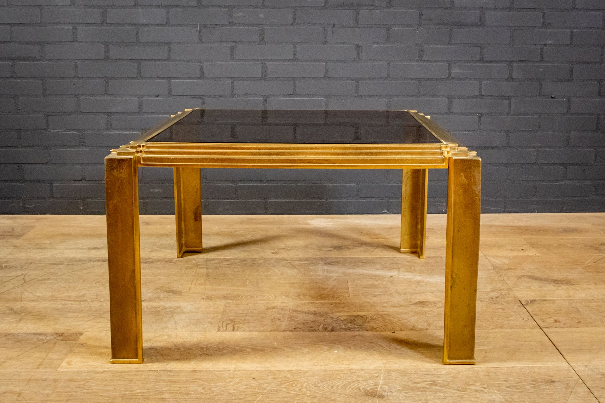 Coffee table made of brass and glass.