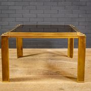 Coffee table made of brass and glass.