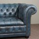 Chesterfield sofa buttoned in blue cowhide, 2.5 seats