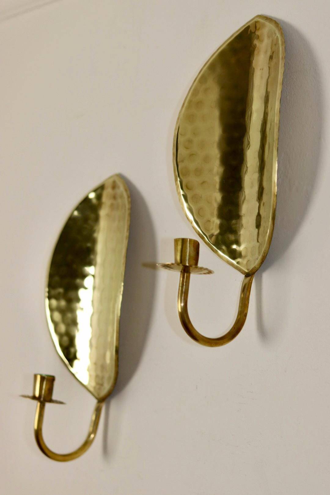 A pair of mid-century Swedish brass wall lights.