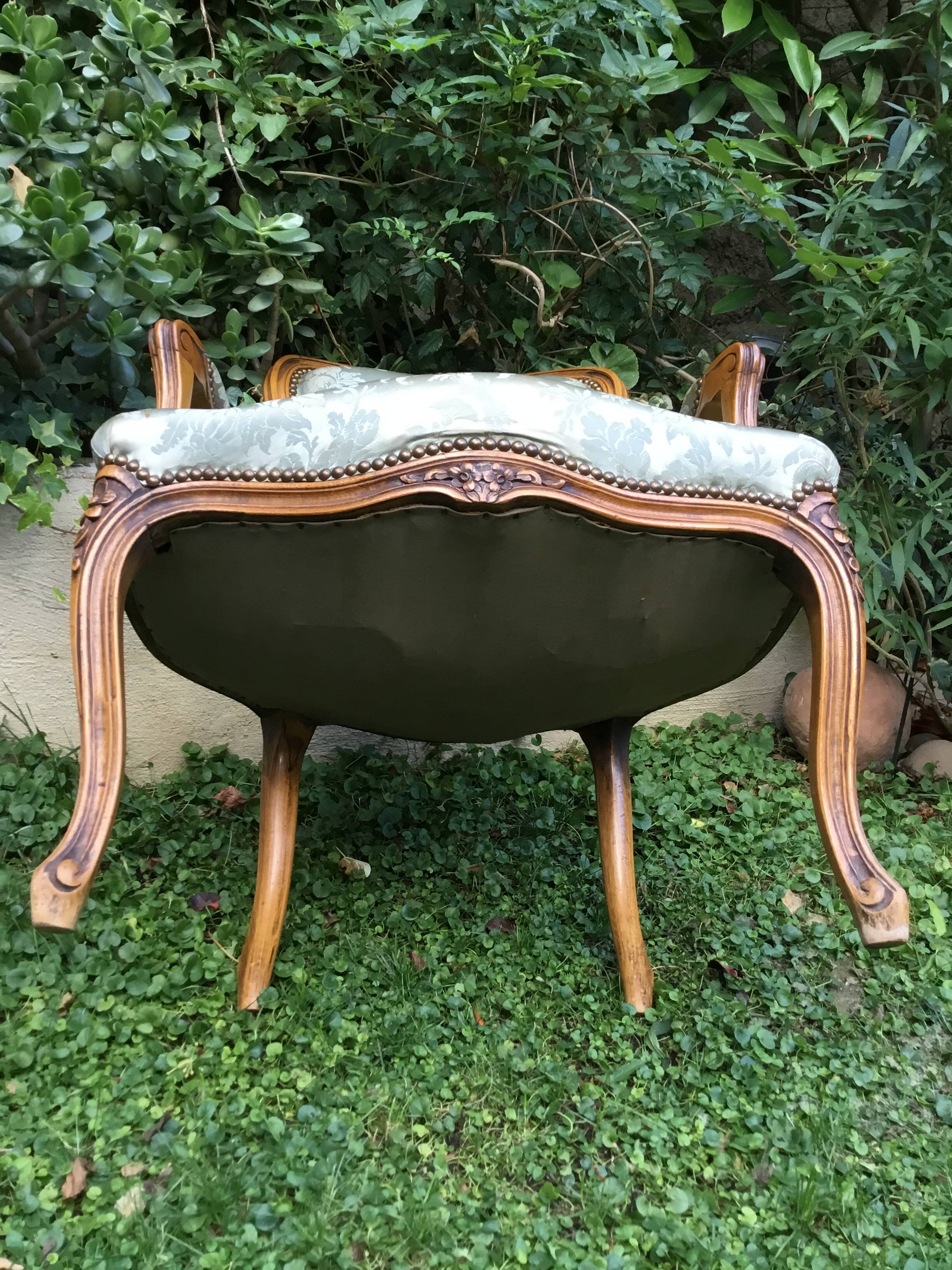 Pair of Louis XV style armchairs in moulded and carved beech.
