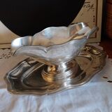 Sauce boat on a scalloped tray in silver metal