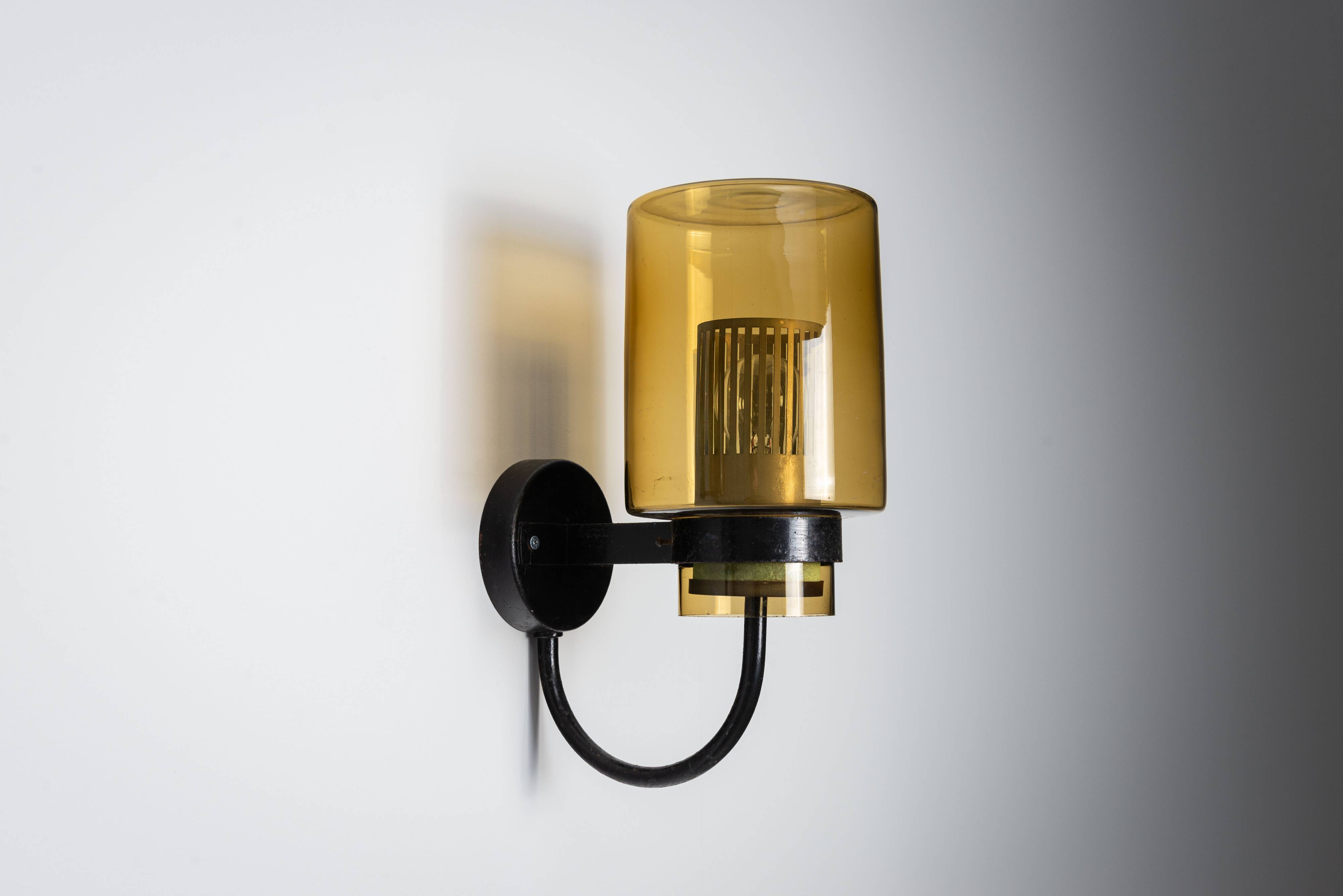 Pair of black metal wall lamps with yellow shades and inner diffuser