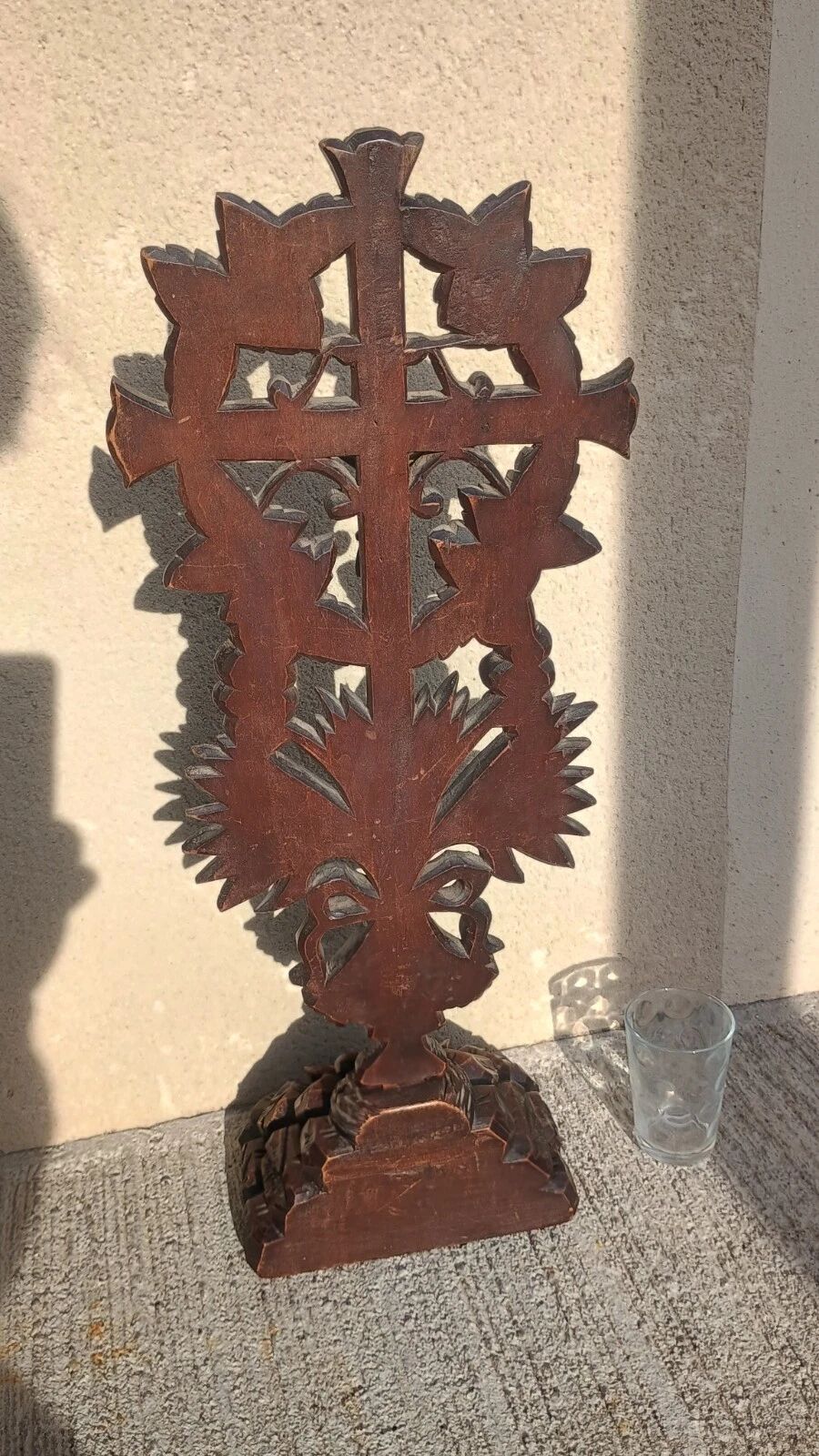Antique wooden crucifix carved from the Black Forest with grapes and leaves.