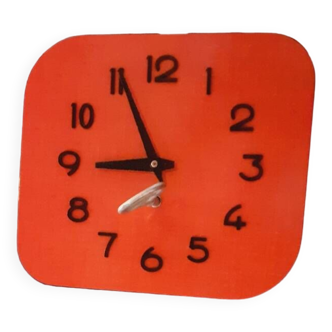 Vintage wall clock from the 50s in red formca