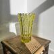 Large Czech vase in pressed glass, tinted yellow with geometric shapes.