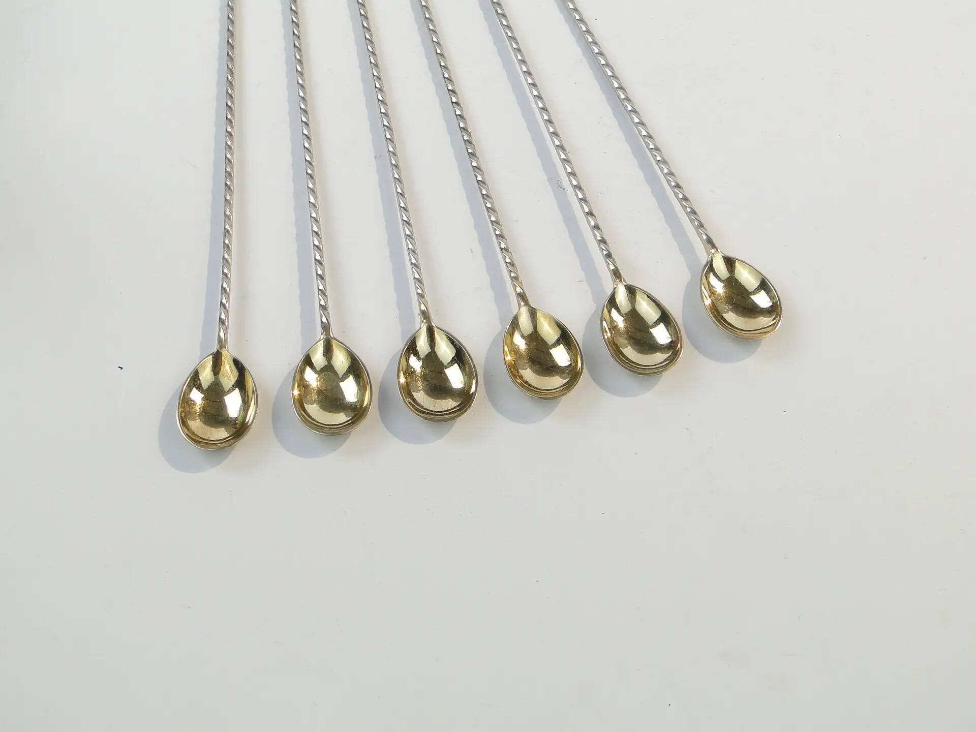 Set of neoclassical cocktail spoons, silver-plated brass, G.A.B., Sweden, 1930s