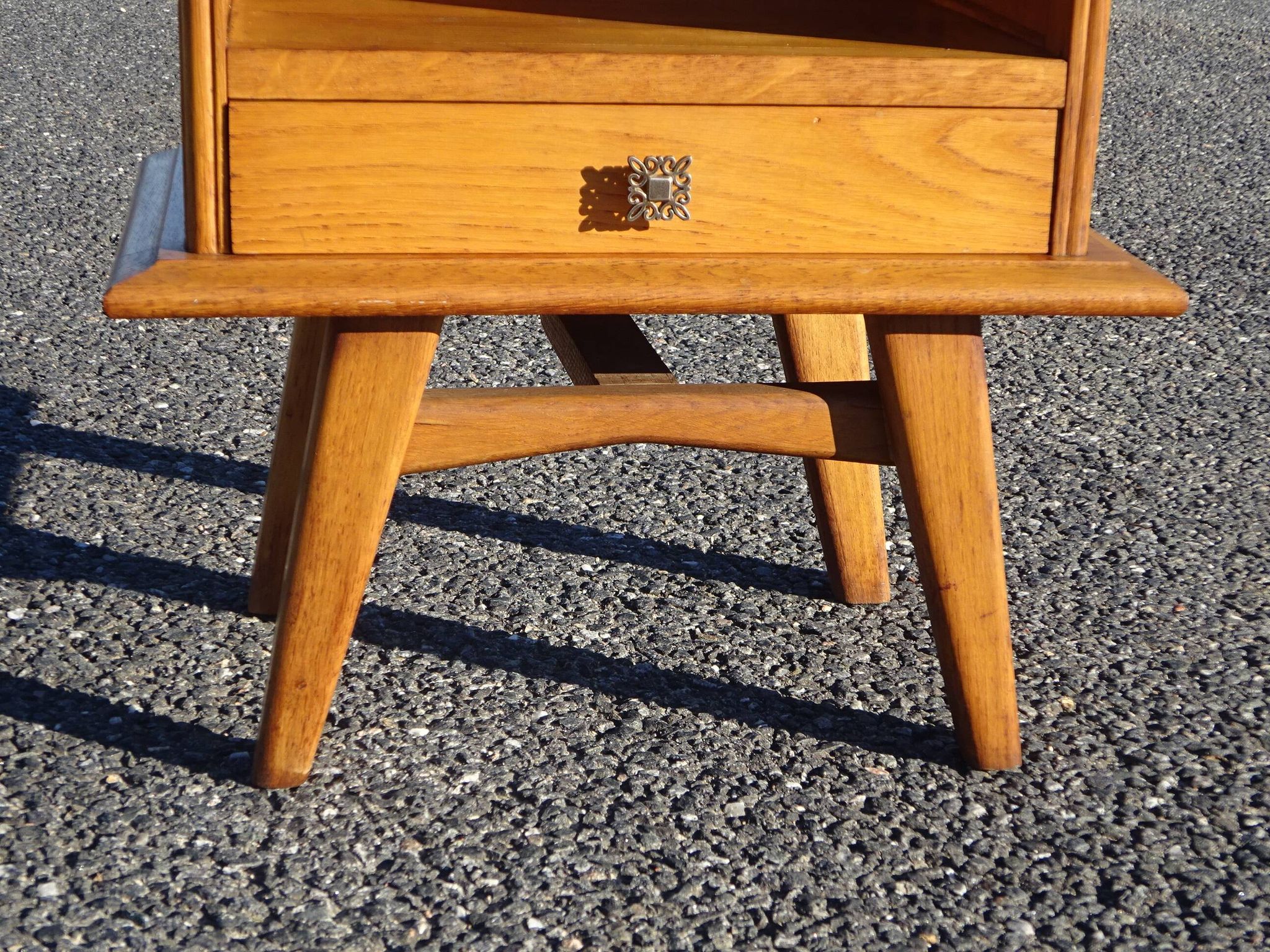 Vintage oak bedside table with tapered legs.