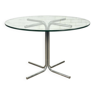 Vintage dining table with tubular frame base and glass top