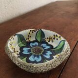 Cup lava foam with blue flower.