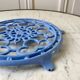 Cast iron coaster painted sky blue early twentieth century
