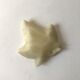 Empty pocket in the shape of alabaster ivy leaves