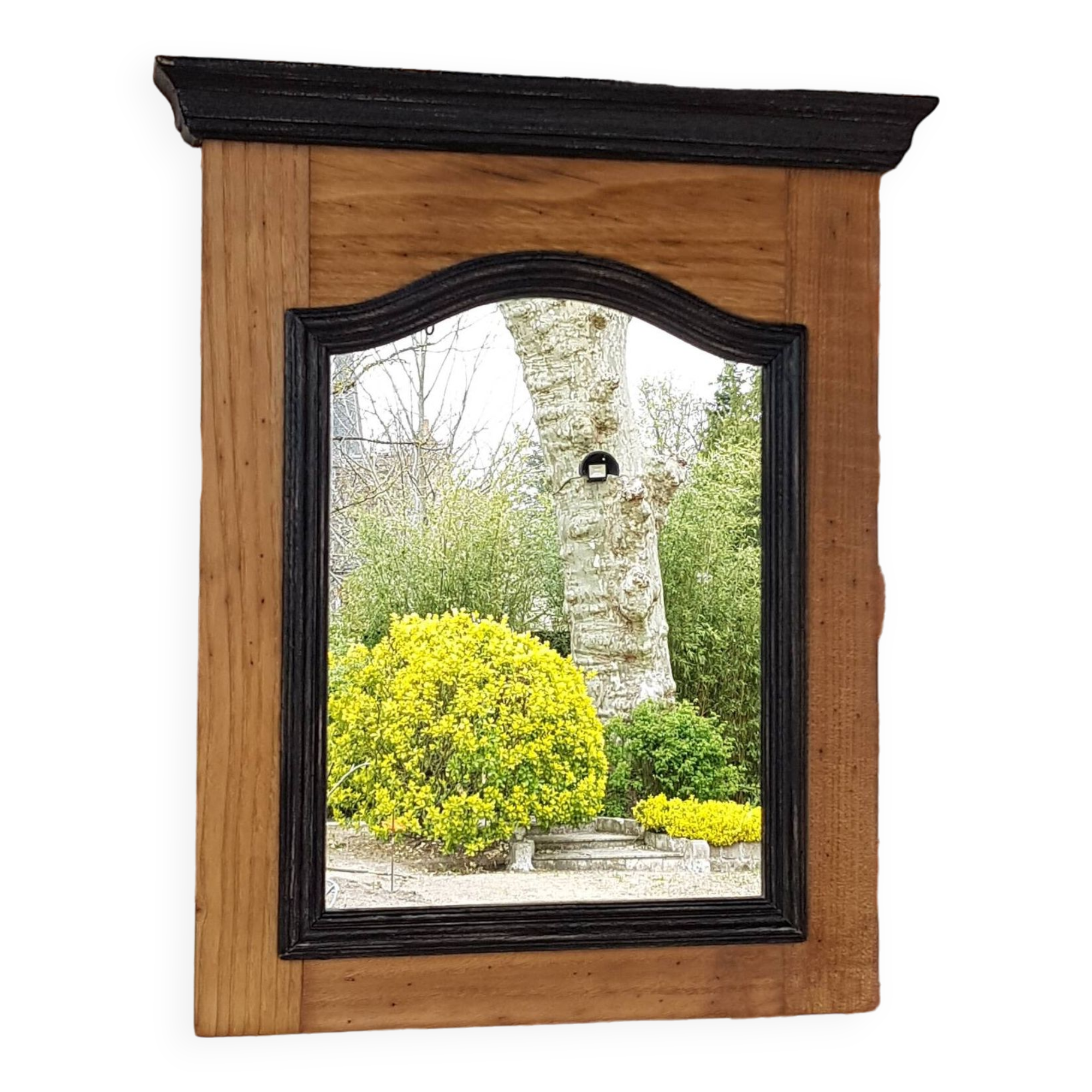 Black mirror and raw natural wood