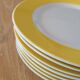 7 yellow and white dessert plates