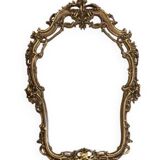 Rocaille style mirror from the 20th century in wood and gilded stucco, Putto on the pediment