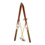 pair of vintage wooden Skis and their bats.