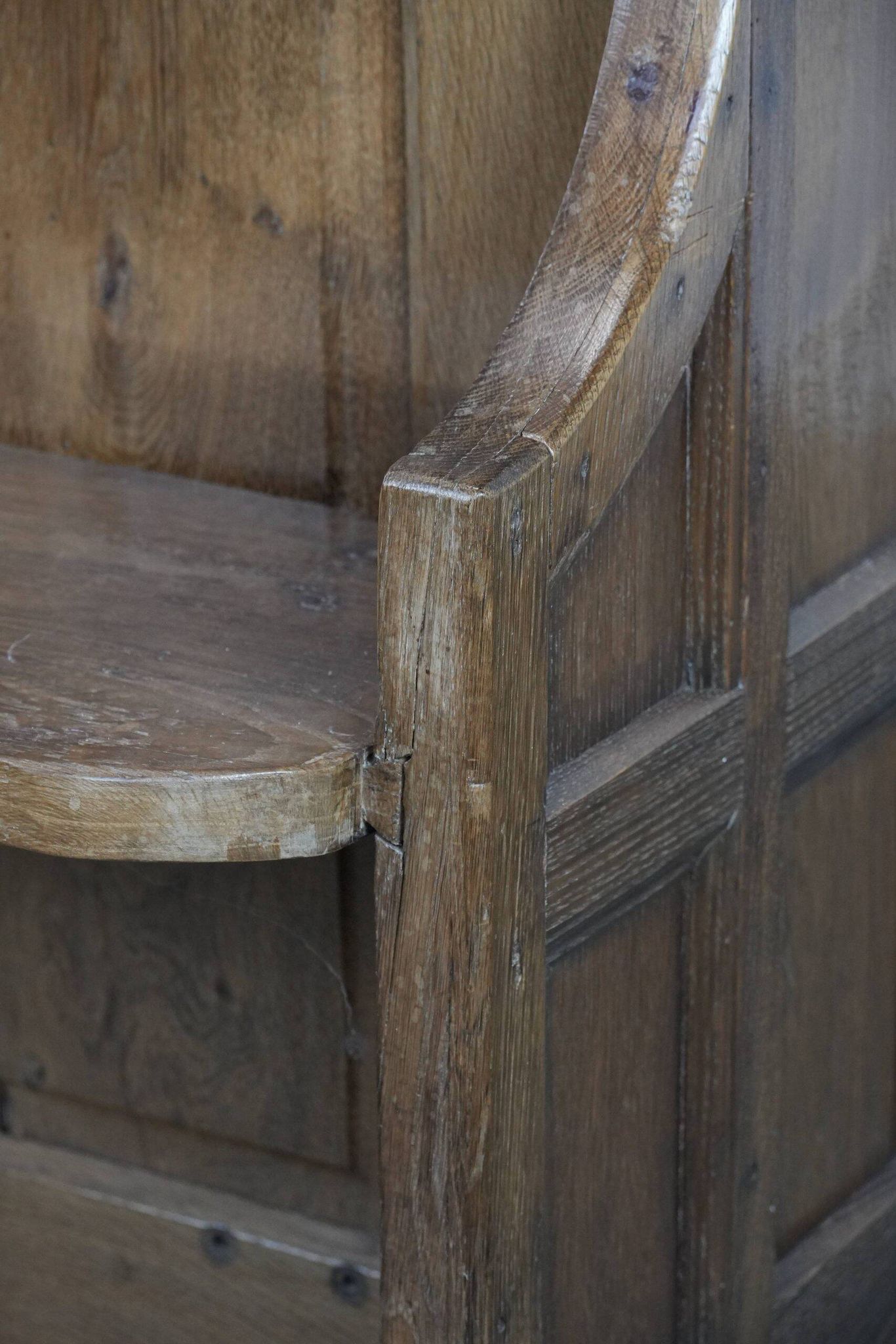 Antique oak church bench in Gothic style with beautiful wood carving