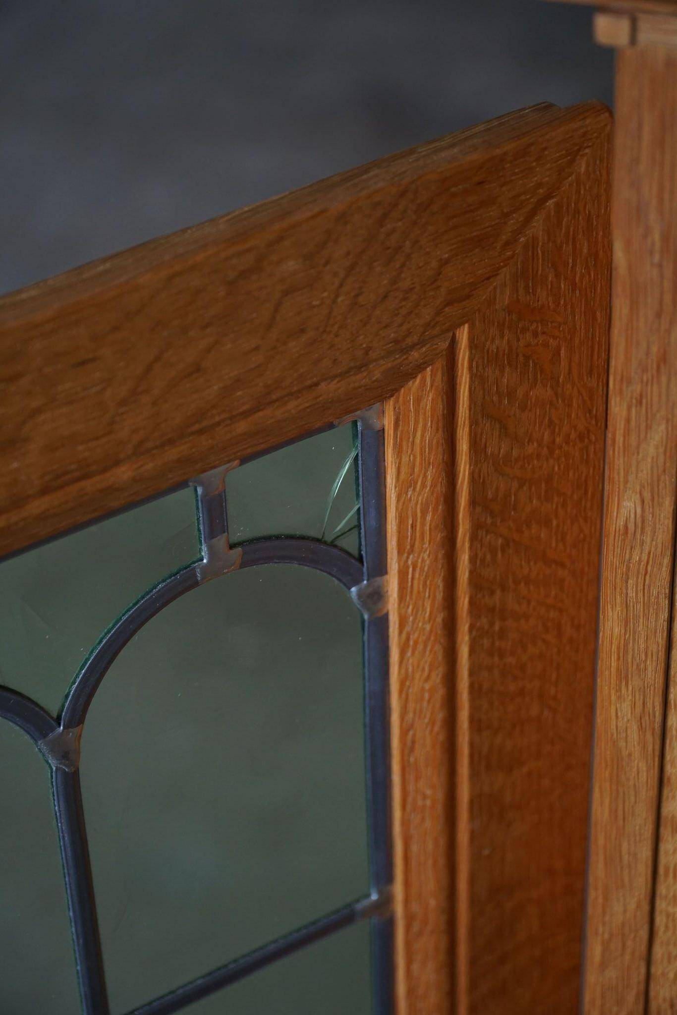 20th-century solid oak display cabinet with a glass front, by a Danish cabinetmaker.