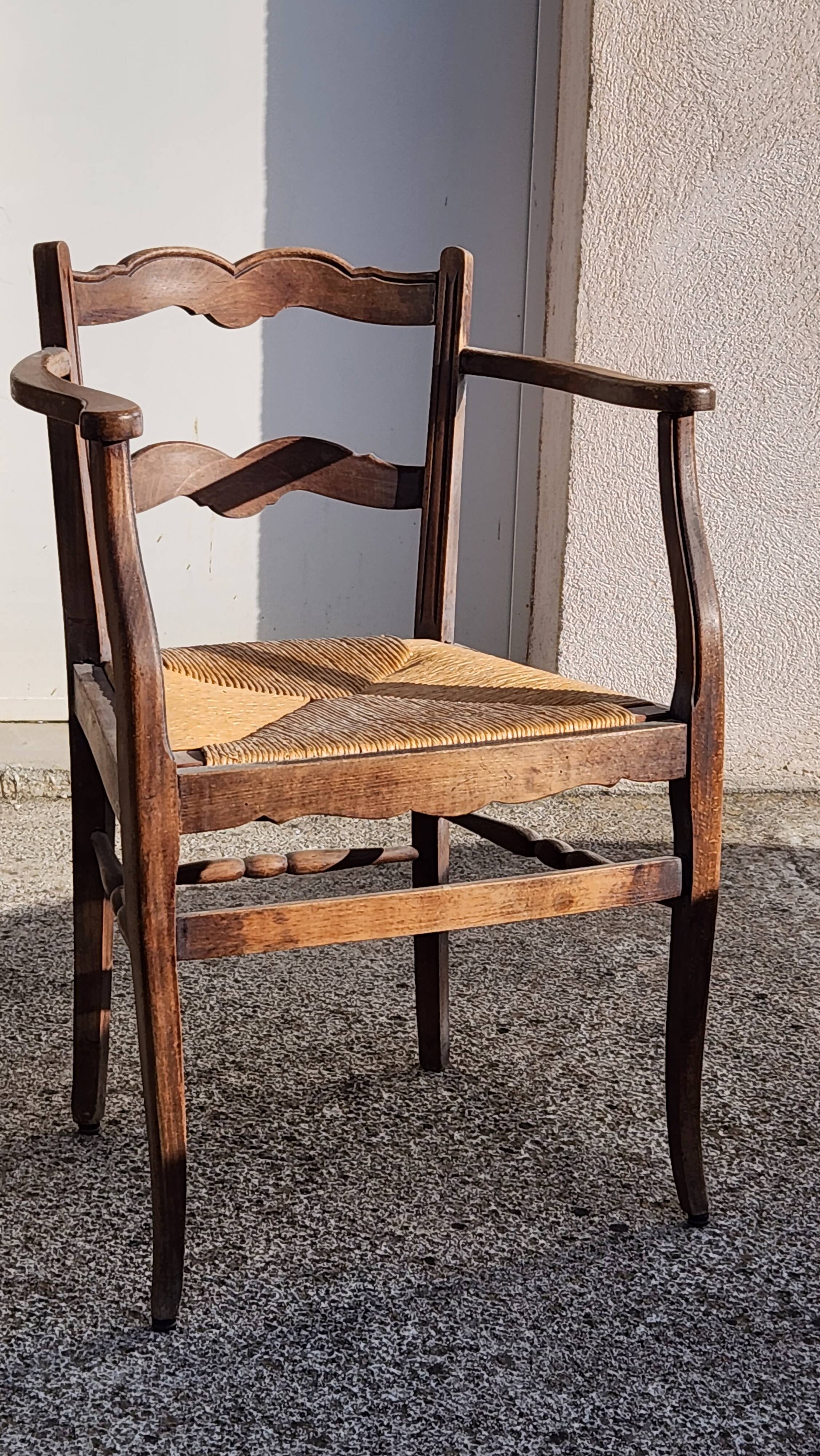 Rustic armchair made of wood and straw