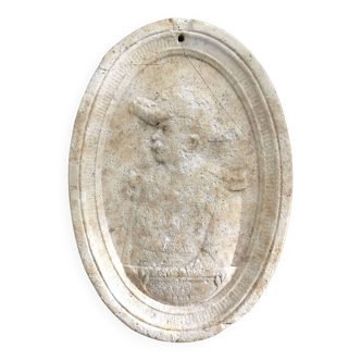 Character on plaster medallion