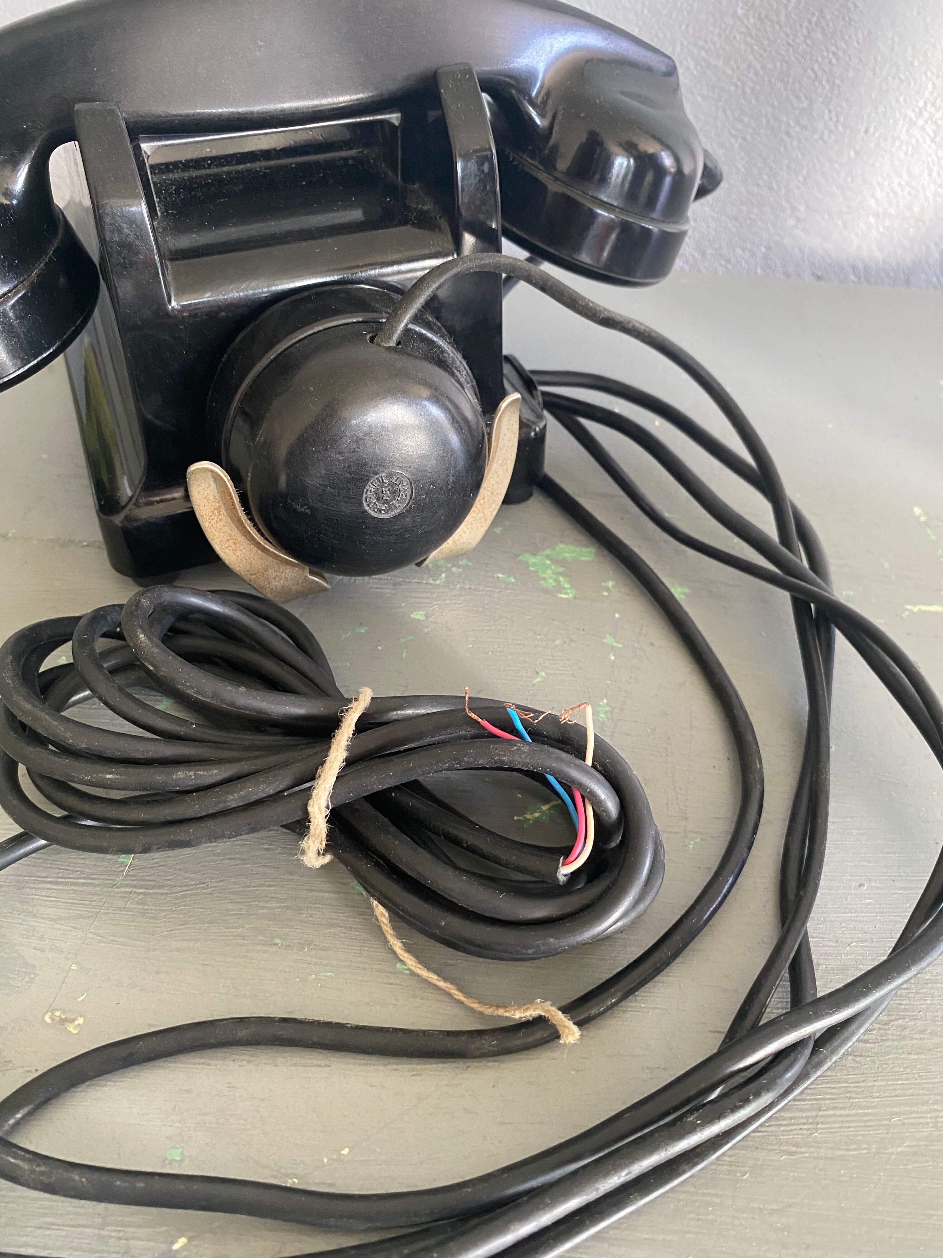 Black Bakelite phone with earphone