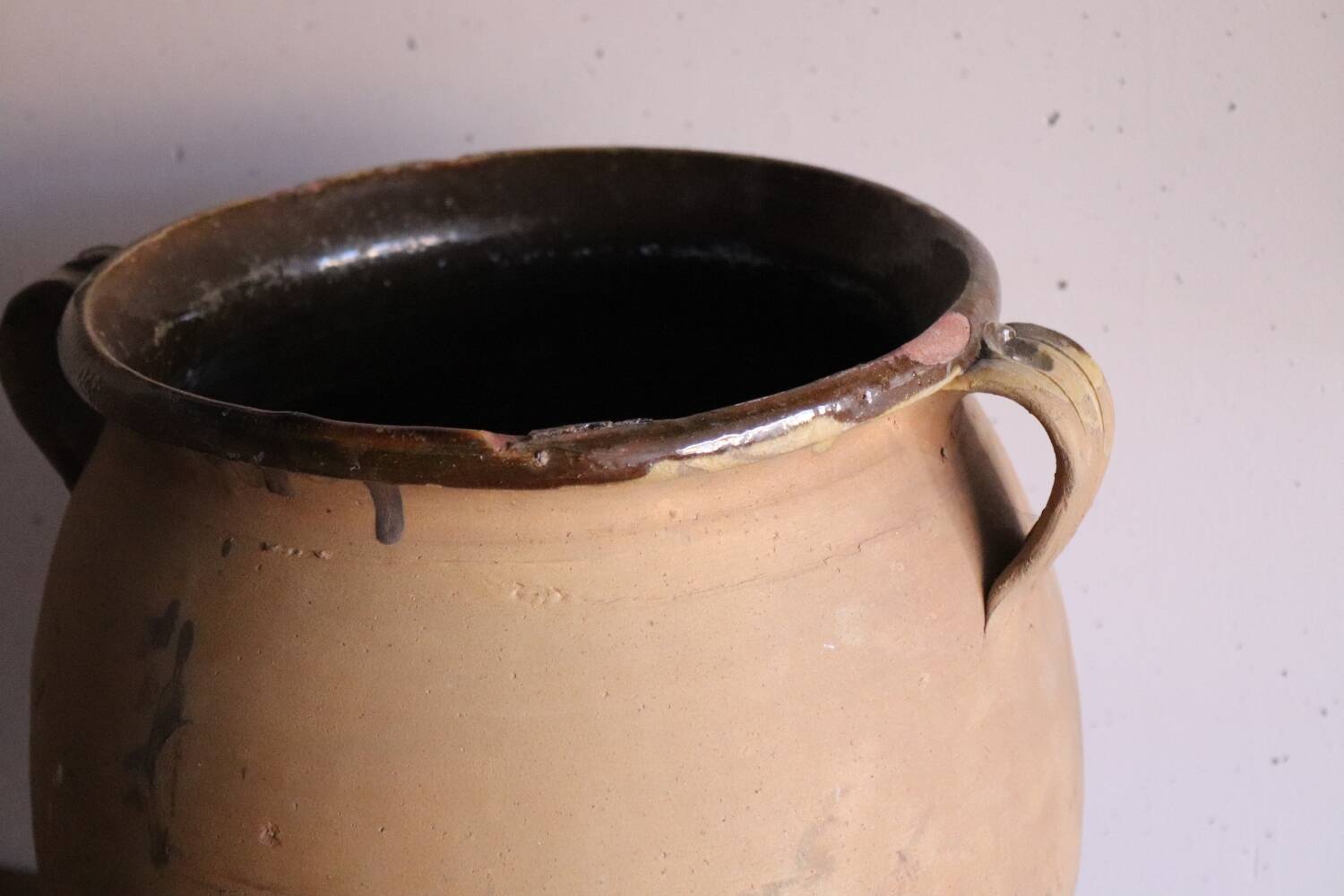 Old glazed terracotta olive jar