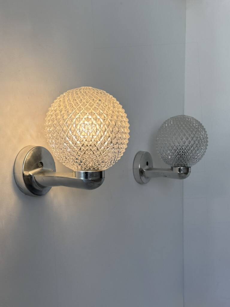 Pair of vintage wall lights in chrome metal and pressed moulded glass, France, 70s.