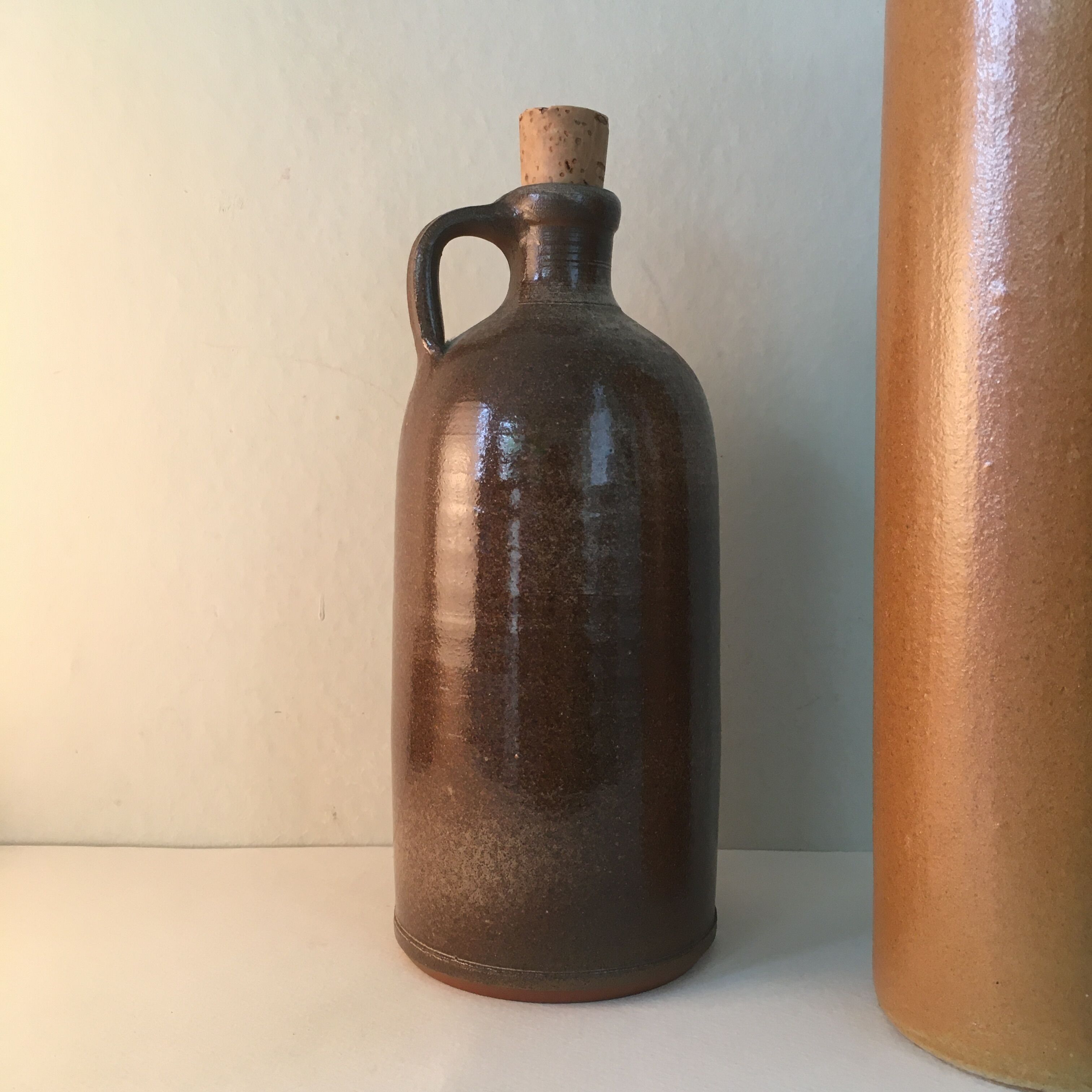 Duo of sandstone bottles