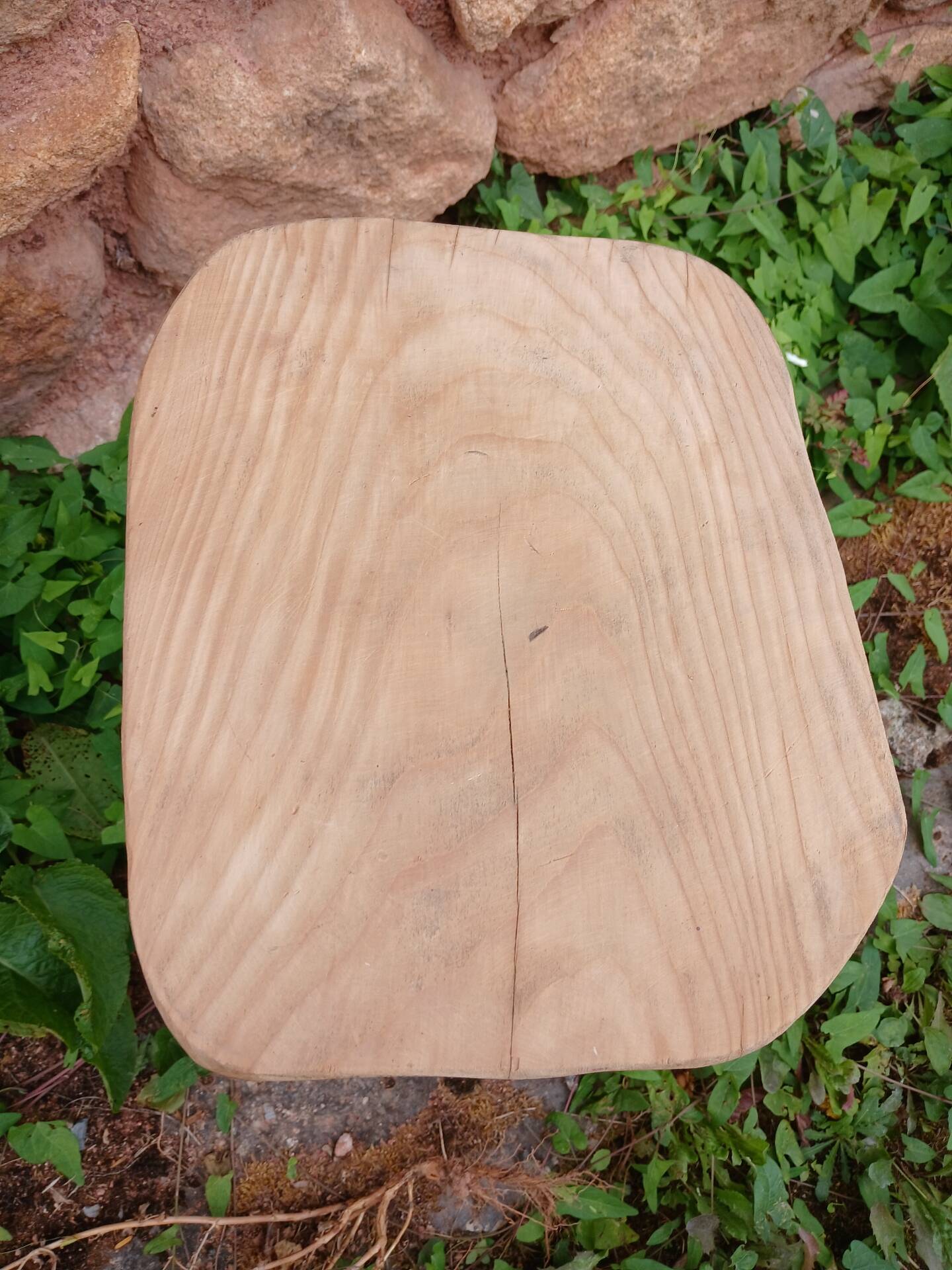 Antique stool in raw wood