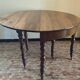 Beautiful antique half-moon table in walnut with its 4 extensions.
