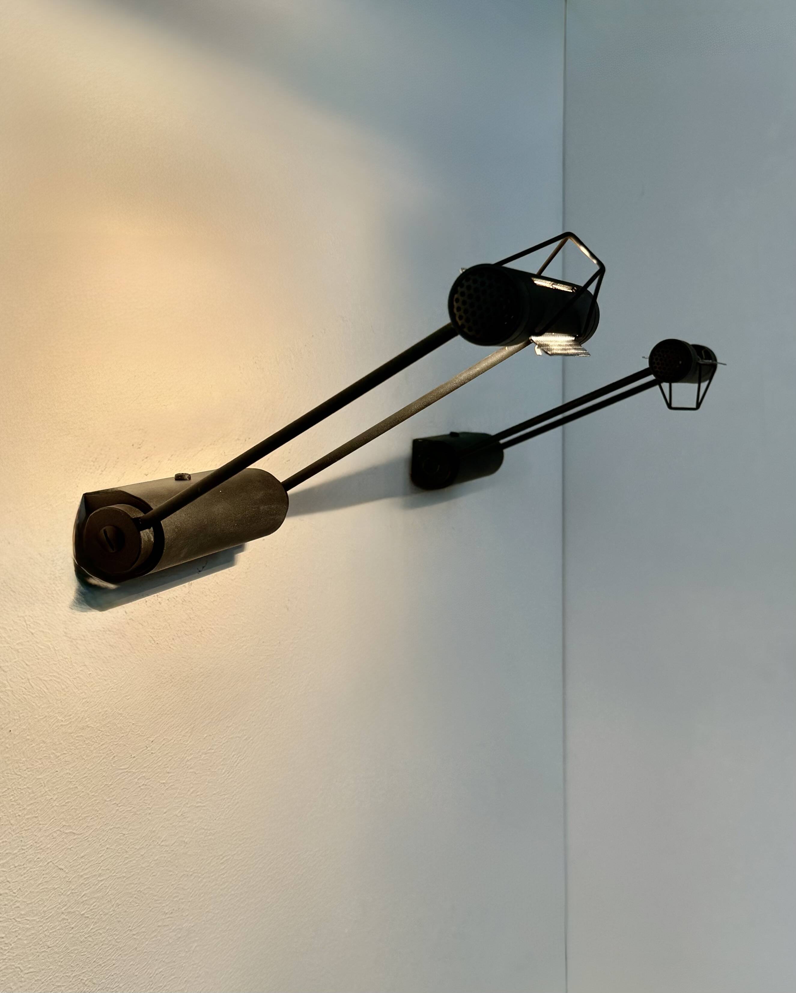 Pair of adjustable vintage wall lights, matte black metal, Italy, 1980.