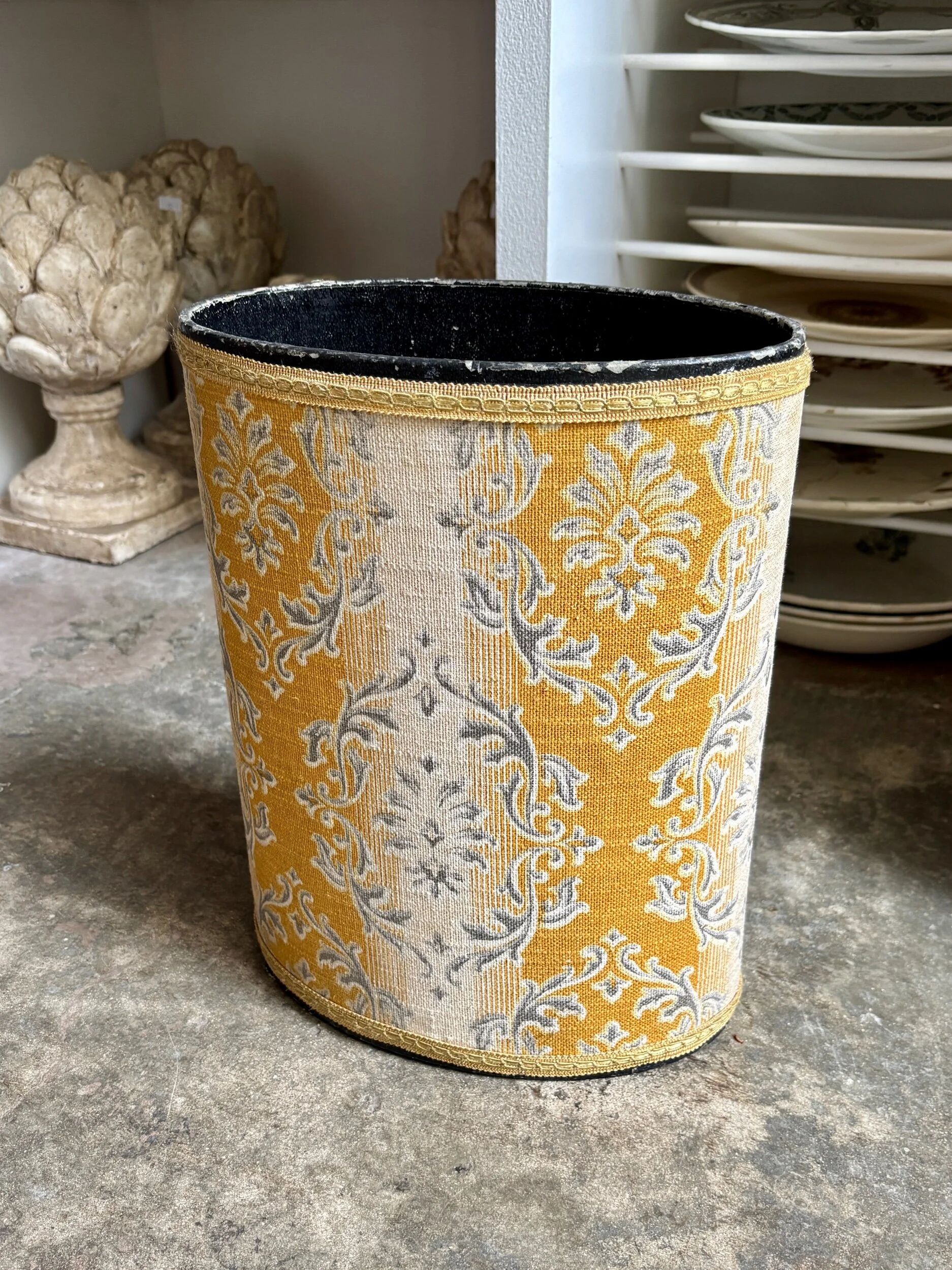 Oval paper bin in woven ochre and grey cotton