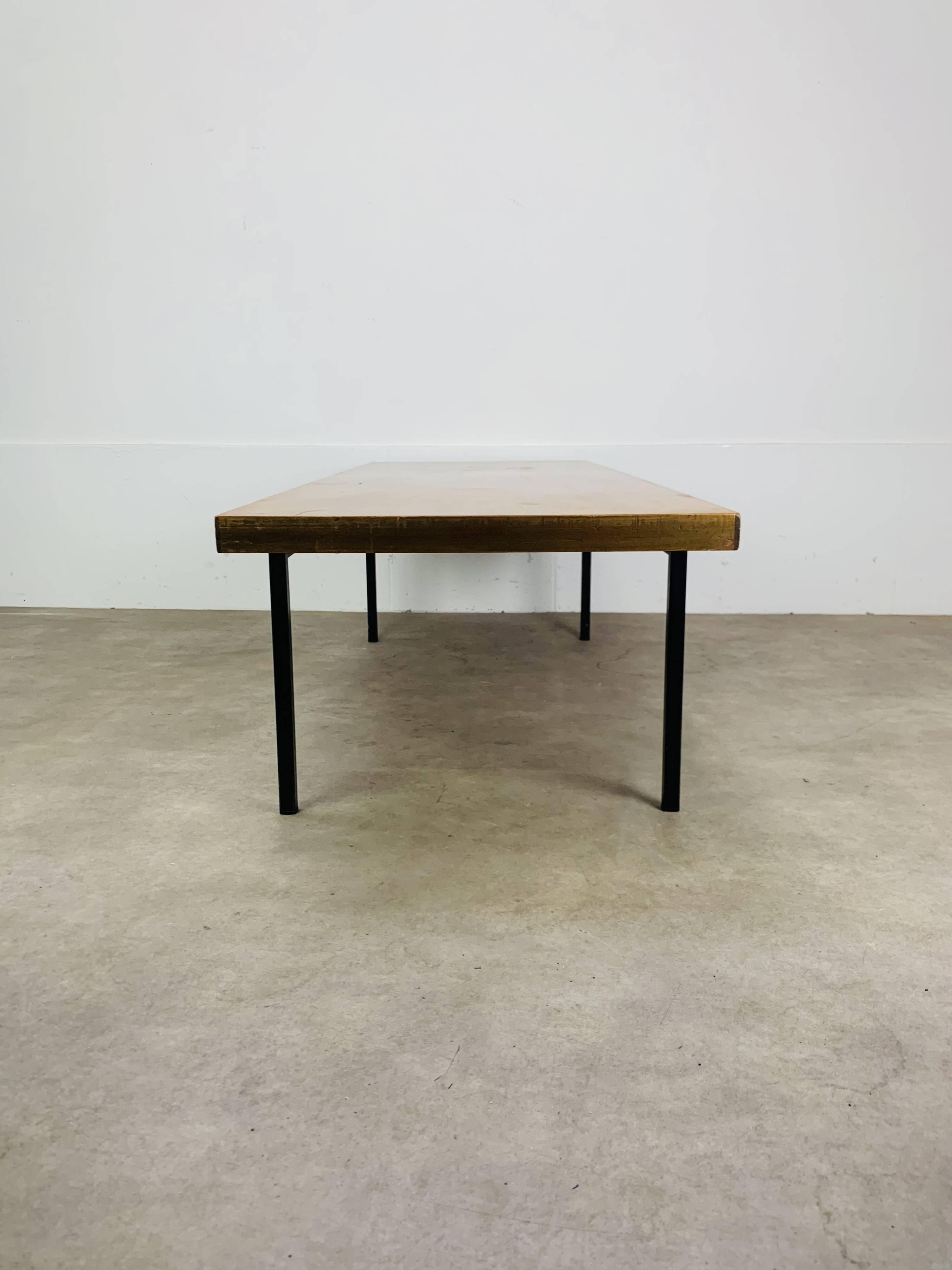 1950s modernist coffee table, wood and black metal.