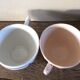 A set of 2 Digoin Sarreguemines cups with pink and blue flowers.